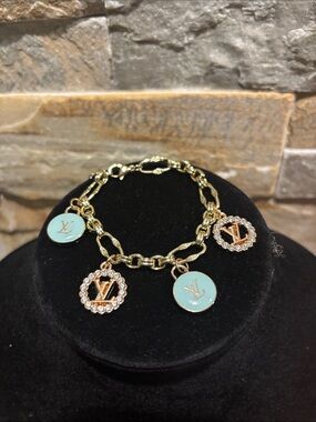 Gold Charm Bracelet with baby blue Enamel and Crystal Accents